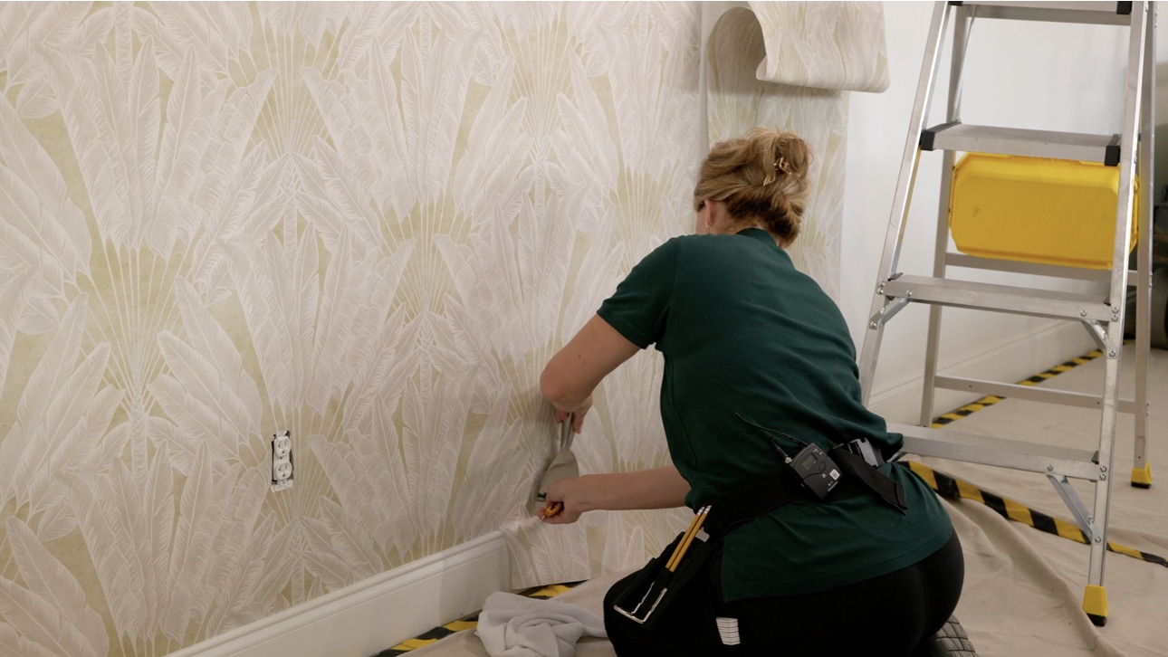 Wallpaper installation in a bright room with patterned walls
